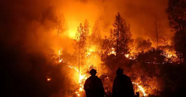 Firefighters battle the Mendocino Complex fire in Northern California. Photo: Justin Sullivan via Getty Images