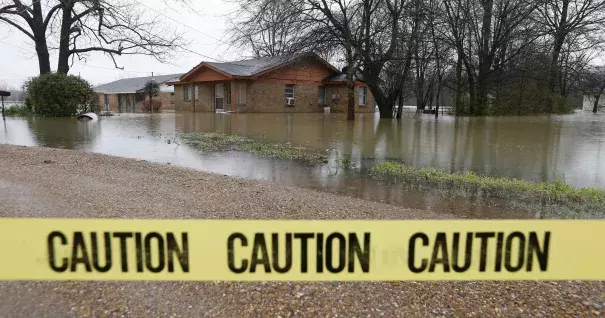 Caution tape closes off this neighborhood in Drew, Miss., Friday, March 11, 2016, as floodwaters have affected areas in the Delta. The flooding has affected the Delta to varying degrees. Photo: Rogelio V. Solis, AP