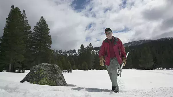 Frank Gehrke, chief of the California Cooperative Snow Surveys Program for the Department of Water Resources, leaves the snow covered meadow after conducting the snow survey at Phillips Station near Echo Summit, Calif., Wednesday, March 30, 2016. Photo: Rich Pedroncelli, AP