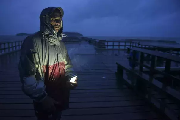David Cruz Marrero watches the waves at Puncta Santiaga pier hours before the imminent impact of Maria, a Category 5 hurricane that threatens to hit the eastern region of the island with sustained winds of 165 miles per hour, in Humacao, Puerto Rico, Tuesday, September 19, 2017. Photo: Carlos Giusti, AP