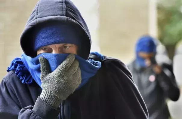 Chris McGuire tries to stay warm as he waits for a space at the City Rescue Mission on Tuesday, Jan 2, 2018, in Jacksonville, Florida. Photo: Will Dickey, The Florida Times-Union via AP