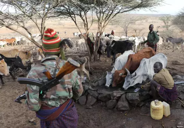 Turkana armed tribesmen stand around a borehole in order to protect their cattle from rival Pokot and Samburu tribesmen near Baragoy, Kenya, Feb. 14, 2017. Photo: Reuters
