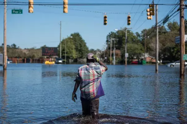 Chris Moore walks down Martin Luther King Blvd. on October 12, 2016 in Lumberton, North Carolina. Hurricane Matthew’s heavy rains ended over the weekend, but flooding is still expected for days in North Carolina. Photo: Sean Rayford/Getty Images