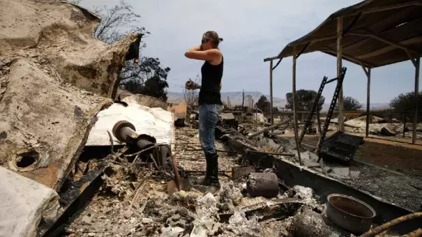 Amy Nelson, 30, breaks down as she goes through the remains of her home devastated by the Erskine Fire, Saturday, June 25, 2016, in South Lake, Calif. "I didn't think it was going to be this bad," said Nelson. Photo: Jae C. Hong, AP