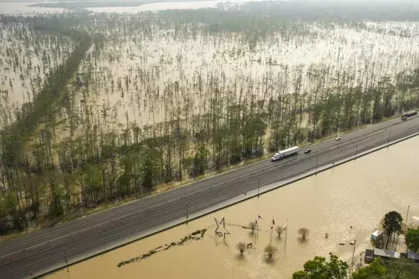 Floodwaters build up around the Texas Travel Information Center, bottom, on Interstate 10 near Orange, Texas. Photo: Brett Coomer, Houston Chronicle/Associated Press