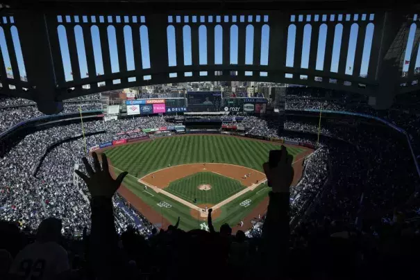 FILE - Fans react after New York Yankees' Aaron Judge hits a home run during the third inning of a baseball game against the San Francisco Giants at Yankee Stadium, April 2, 2023, in New York. A new study released Friday, April 7, 2023, finds that climate change is making major league sluggers into even hotter hitters, sending an extra 50 or so home runs a year over the fences. (AP Photo/Seth Wenig, File)