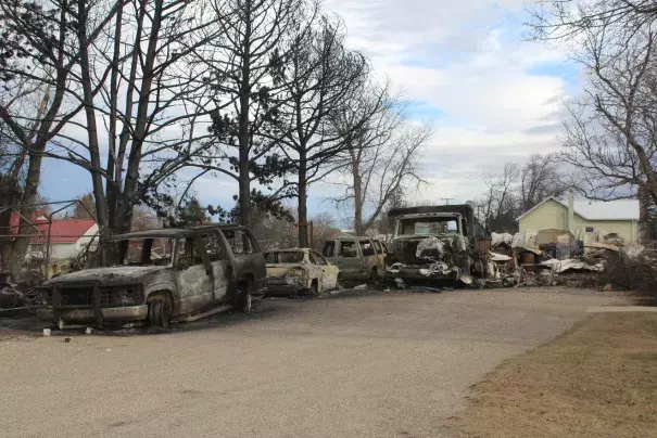 Cars and trucks destroyed by the West Wind Fire in Denton on Dec 1. Credit: David Murray, Great Falls Tribune)