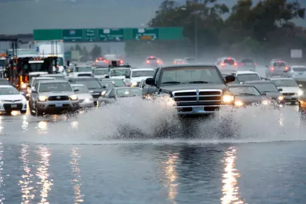 Motorists crawl along Interstate 280 as flooding blocked three lanes in San Jose, Calif., on Tuesday, Jan. 5, 2016. Photo: Gary Reyes,  Bay Area News Group