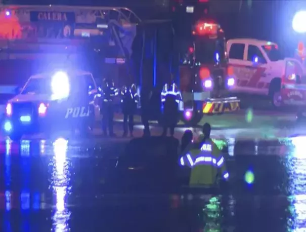 In this image taken from video, emergency rescue teams attend to a vehicle stranded in floodwaters in Hoover, Alabama, late Oct. 6, 2021. As much as 6 inches (15 cm.) of rain fell in Alabama in about a day, unleashing flash floods that required some people to be rescued. (ABC 33/40 via AP)