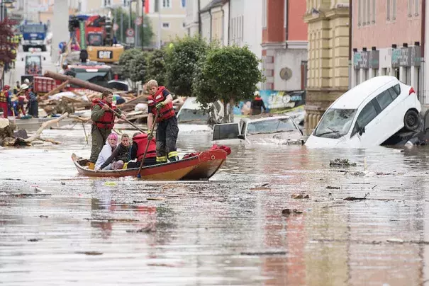 Firemen rescue two women with their boat following heavy floods the day before on June 2, 2016 in Simbach am Inn, Germany. Flash floods from the swollen Inn river took local communities by surprise, trapping children at schools and forcing some residents to flee to their rooftops. Photo: Sebastian Widmann, Getty Images