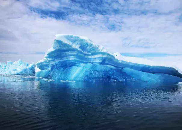 This year is set to be Earth's warmest in millennia, according to new data—with profound implications. Here, calved icebergs are seen floating on the water on July 30, 2013, in Qaqortoq, Greenland. Photo: Joe Raedle, Getty Images