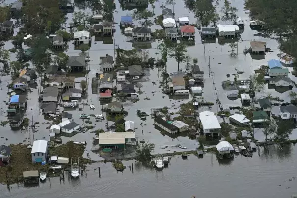 FILE - Floodwaters slowly recede in the aftermath of Hurricane Ida in Lafitte, La., Sept. 1, 2021. A new study says that back-to-back hurricanes that hit the same general place in the United States seem to be happening more often. (Credit: AP Photo/Gerald Herbert, File)