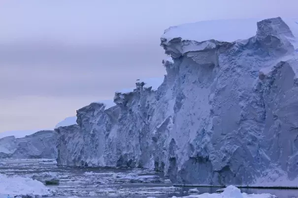Thwaites Glacier ice cliffs can be several hundred feet high, with an area of ice nearly the size of Nebraska behind. (Credit: James Kirkham via Inside Climate News)