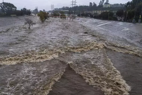 FILE - The Los Angeles River flows downstream in Los Angeles, Jan. 14, 2023. (Credit: AP Photo/Damian Dovarganes, File)