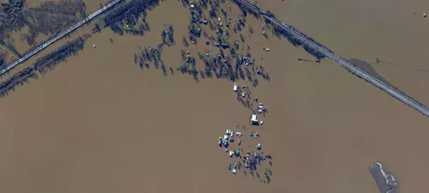 Dozens of houses are seen here underwater in West Alton, Missouri, a town of 522 people. The community lies at the confluence of the Missouri and Mississippi Rivers. (NOAA)