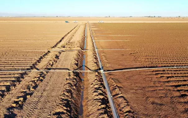 A view of fields, irrigation canal and pipes in Holtville, California, U.S., September 20, 2022. (Credit: REUTERS/Aude Guerrucci/File Photo)