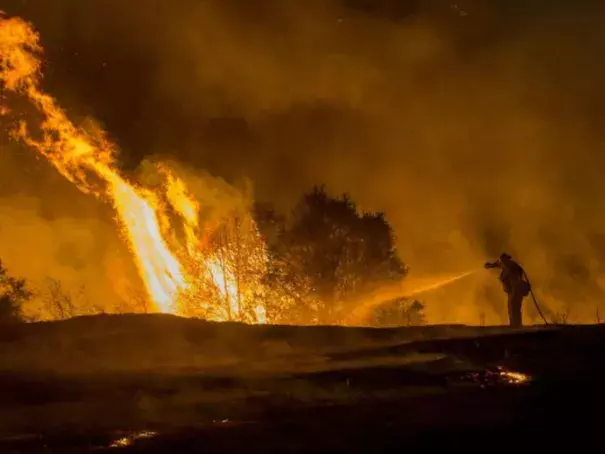 Dousing fire (Photo: Josh Edelson, AFP/Getty Images)