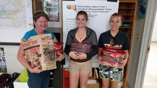 Residents pack up cookies they made for firefighters. (Photo: Fire incident management team on Facebook)