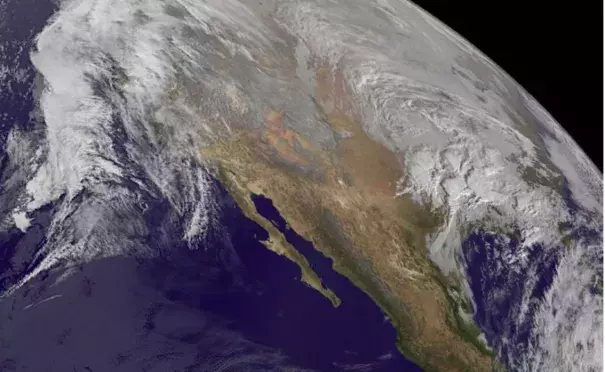 Winter storm Jonas gathers itself on Thursday. Near-record sea surface temperatures in the mid-Atlantic – which scientists suggest are driven in part by global warming – are helping to fuel this storm. Phot: NASA/NOAA GOES Project