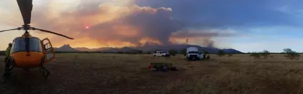 Helicopter-related firefighting efforts were limited on Sunday at the uncontained Brown Fire in far south Arizona, which has affected more than 8000 rugged acres in the Baboquivari Mountains southwest of Tucson. Believed to be caused by humans, the fire is now under investigation. Photo: AZ State Forestry.