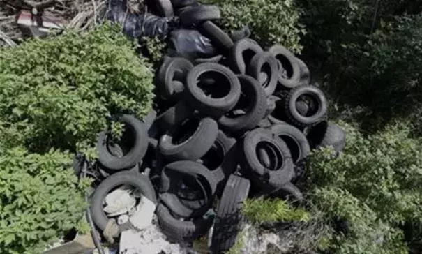 In this photo taken June 22, 2016, a pile of tires sits in a neighborhood near downtown Houston. Trash piles like this are textbook habitat for the mosquitoes that carry Zika, and one example of the challenge facing public health officials. Photo: David J. Phillip, AP