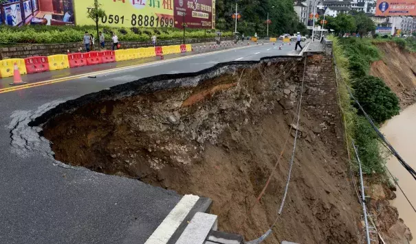 A road is washed away in Minqing county, south-east China’s Fujian province, on Sunday in the wake of super typhoon Nepartak. Photo: Xinhua / Barcroft Images