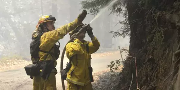 Cal Fire firefighters extinguish hotspots while fighting the Soberanes Fire in Palo Colorado Canyon on the northern Big Sur Coast on Tuesday July 26, 2016 in Big Sur, Calif. Photo: David Royal, AP