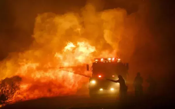 Firefighters combat the front lines of the Sherpa Fire to keep it from moving onto Highway 101, along Calle Real Road in Goleta, on June 16, 2016. Photo: Marcus Yam Los Angeles Times/TNS