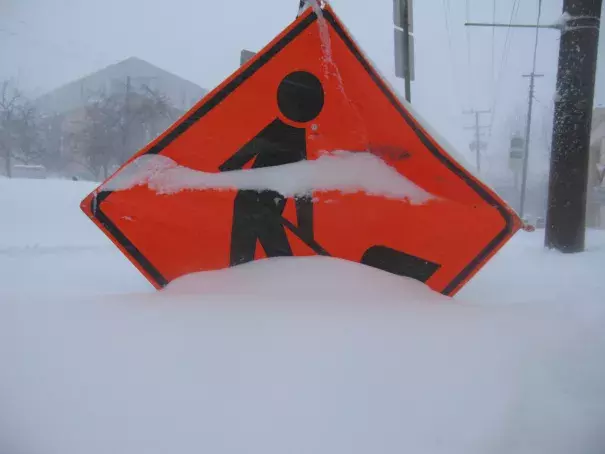 Sign partially covered by snow Jan. 23 in DC during the storm named Snowzilla. Photo: Rebekha Halseth