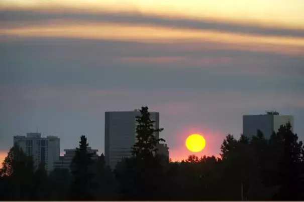 The setting sun is obscured by smoke from the Sockeye wildfire that started near Kashwitna Lake on Sunday afternoon. Image: Bill Roth / ADN