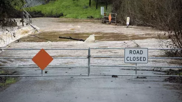 Water floods Mormon Bar Crossing in Mariposa, Calif., on Thursday, March 22, 2018. Photo: Andrew Kuhn