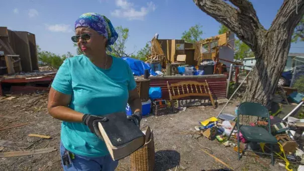 In this Thursday, Sept. 14, 2017, photo, Barbara De Luna holds a bible she recovered from her destroyed home in Bayside, Texas. Bayside took a direct hit from Hurricane Harvey on Aug. 25. Photo: Mark Mulligan, Houston Chronicle via AP