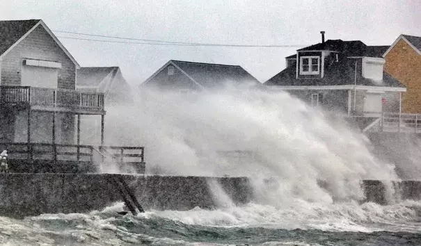 Blizzard conditions slammed snow and spray into the coast of Scituate, Mass., south of Boston, on Thursday, Jan. 4, 2018. Photo: Greg Derr /The Quincy Patriot Ledger via AP