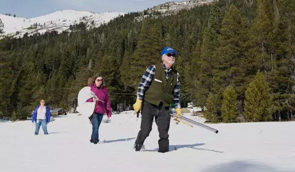 Frank Gehrke (California Department of Water Resources) crosses a snow-covered meadow as he conducts the second snow survey of the season Thursday, Feb. 1, 2018, near Echo Summit, Calif. Accompanying Gehrke are Michelle Mead, left, and Courtney Obergfell, both of the National Weather Service. Photo: Rich Pedroncelli, AP