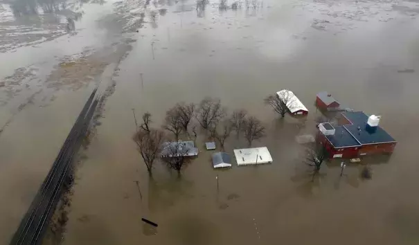 This aerial photo from Tuesday, March 19, 2019, shows flooding along the Missouri River in Pacific Junction, Iowa. The U.S. Army Corps of Engineers says rivers breached at least a dozen levees in Nebraska, Iowa and Missouri. Hundreds of homes are damaged, and tens of thousands of acres are inundated with water. Photo: DroneBase via AP