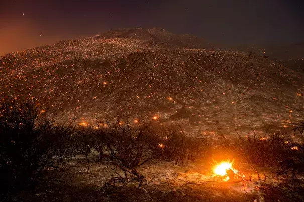 Embers from the Blue Cut fire smolder along Lytle Creek Road near Keenbrook, CA, on Wednesday, August 17, 2016. Photo: Noah Berger, AP