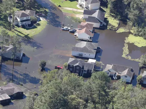 Flood waters recede from houses of a Savannah, Georgia, neighborhood in the aftermath of Hurricane Matthew, on Oct. 9, 2016. Photo: Curtis Compton, AP