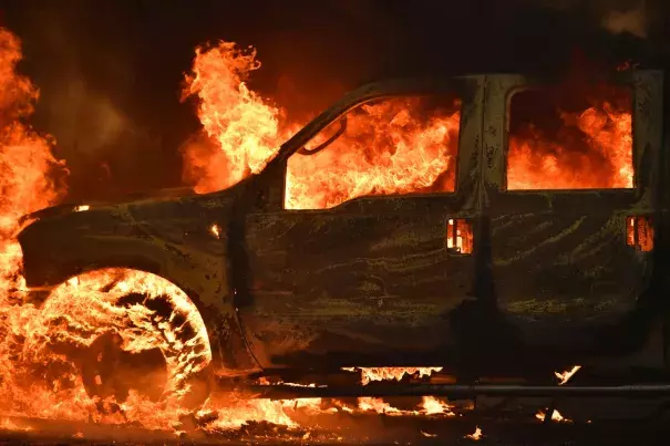 A truck burns on Main Street in the town of Lower Lake, Calif. on Sunday. Photo: Josh Edelson, AP
