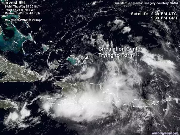 Satellite image of 99L taken at 10:39 am EDT August 25, 2016. A surface circulation center was trying to form over the southeastern Bahamas and Turks and Caicos Islands. Image: NASA, Weather Underground