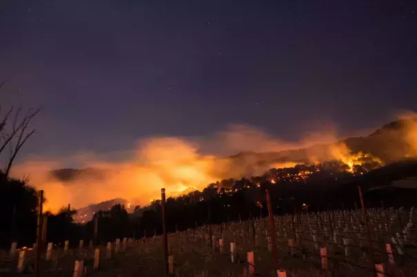 Fires spread by the Diablo winds and fueled by dry grass and brush spread through California's Napa and Sonoma regions in early October 2017. Scientists say climate change is loading the dice for wildfires. Photo: Josh Edelson, AFP/Getty Images