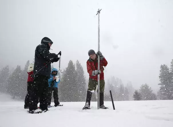 Frank Gehrke, right, chief of the California Cooperative Snow Surveys program for the Department of Water Resources, lifts a survey tube out of the snow during a manual survey at Phillips Station near Echo Summit, Calif., on March 30. Photo: Rich Pedroncelli, Associated Press