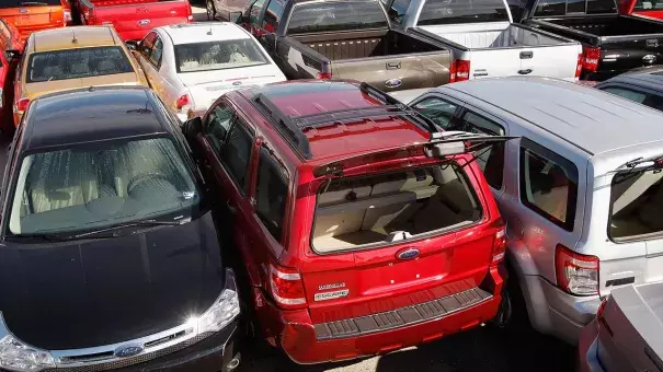 Cars sitting in the rear of a used car lot were left pushed together following Hurricane Ike September 16, 2008, in Galveston, Texas. Today, cars from Hurricane Harvey are being sold in the marketplace. Photo: Scott Olson/Getty Images