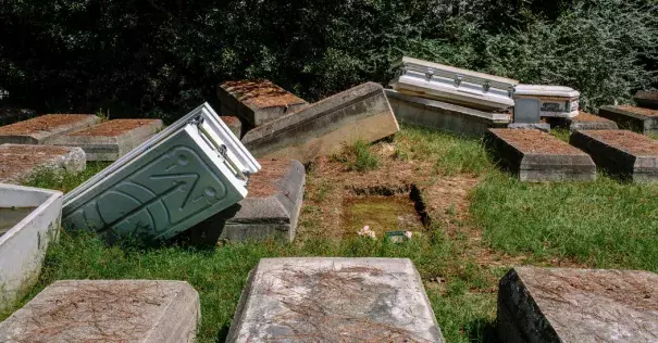 A number of coffins had either been moved or washed away by floods this year in Denham Springs, La. Photo: William Widmer for The New York Times