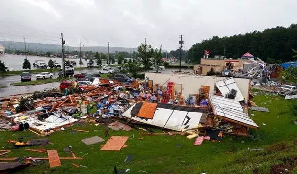 At approximately 1 pm CDT Thursday, Cindy spawned an EF2 tornado that left damage in areas southwest of Birmingham, Alabama, and injured at least four people. According to weather.com, Severe damage was reported to a Kentucky Fried Chicken restaurant in Fairfield, a town of 10,000 about 10 miles southwest of Birmingham. WTVM-TV said an Express Oil Change shop and an ABC liquor store were destroyed, and three people were hospitalized with minor injuries. Photo: Butch Dill, AP