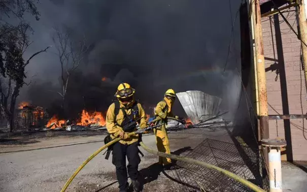 Firefighters battle Clayton Fire in the town of Lower Lake. Photo: Sacramento Bee