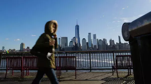 A commuter from New Jersey to New York, bundled up against the wind and the cold temperatures on November 10, 2017 in Exchange Place, Jersey City, N.J. The National Weather Service issued a freeze warning for the area. Photo: Getty Images