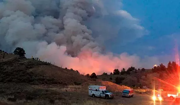 This photo provided by the Department of Homeland Security Emergency Management shows a wildfire burning near Forbes Park in southern Colorado, Thursday, June 28, 2018. Hot, dry and windy weather has raised the fire danger across much of Colorado as well as Utah and parts of Arizona and Nevada. Credit: DHSEM via AP