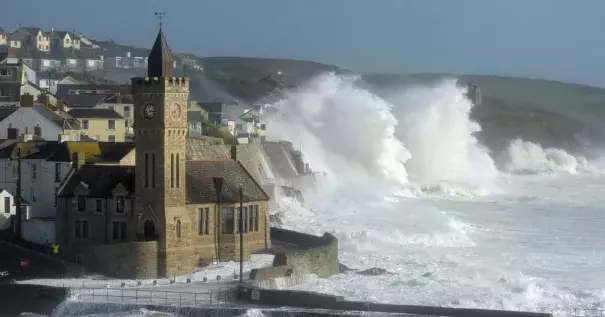 Waves break around the church in the harbor at Porthleven, Cornwall, as post-tropical cyclone Ophelia hits the UK and Ireland. Photo: Ben Birchall, PA Images