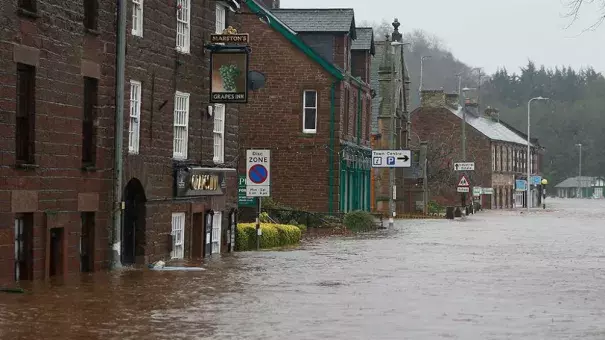 Flooded roads in the centre of Appleby, north west England, as Storm Desmond hits the United Kingdom, Saturday Dec. 5, 2015. Roads have been closed throughout the North and Scotland as Storm Desmond caused road chaos, landslides and flooding. Photo: Owen Humphreys/AP