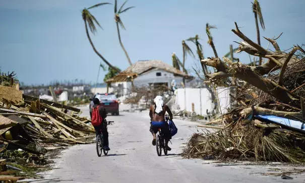 Residents pass damage caused by Hurricane Dorian in Marsh Harbour, Great Abaco Island in the Bahamas. Photo: Brendan Smialowski, AFP/Getty Images